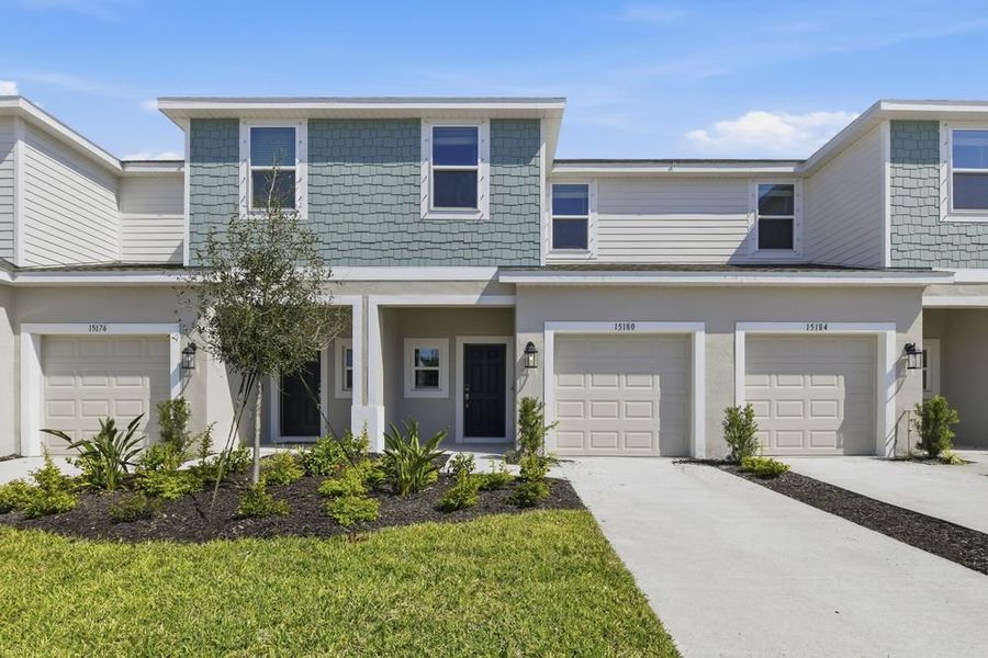 Front exterior of a new home in Vinterra Townhomes, Nokomis, FL, highlighting curb appeal (Image 1). Front exterior of a new home in Vinterra Townhomes, Nokomis, FL, highlighting curb appeal (Image 1).