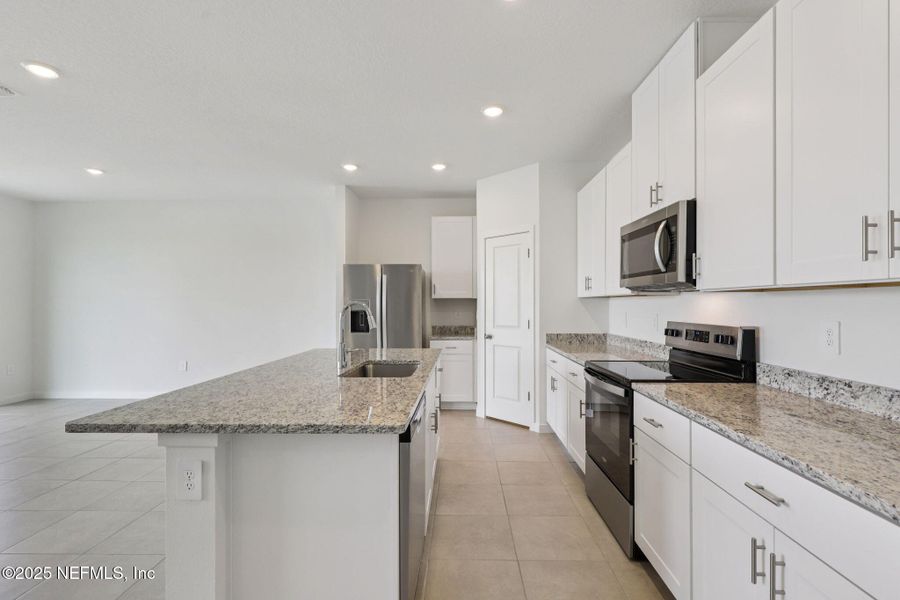 Furnished interior view inside a new home in Lakes at Bella Lago - Signature Series, Green Cove Springs (Image 5). Furnished interior view inside a new home in Lakes at Bella Lago - Signature Series, Green Cove Springs (Image 5).