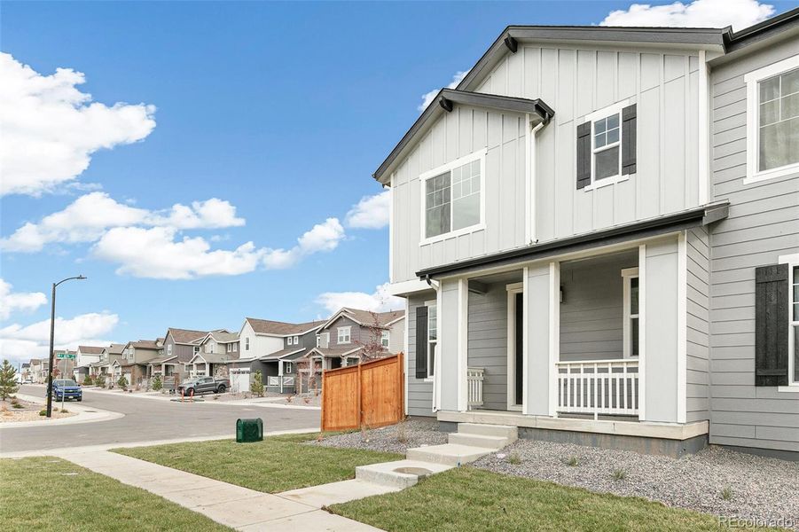 Exterior details and patio area of a home in Sky Ranch Villas, Watkins (Image 4).