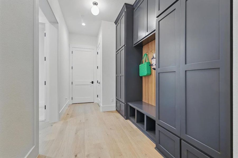 Mudroom with light wood-style floors and recessed lighting Mudroom with light wood-style floors and recessed lighting