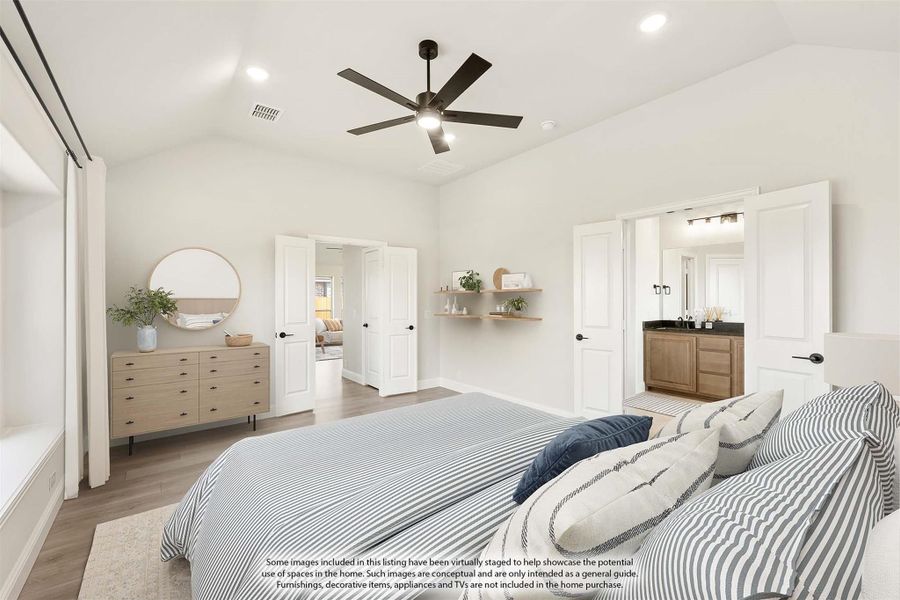 Master bedroom with vaulted ceiling, ceiling fan, hardwood floors, and ensuite bathroom access Master bedroom with vaulted ceiling, ceiling fan, hardwood floors, and ensuite bathroom access