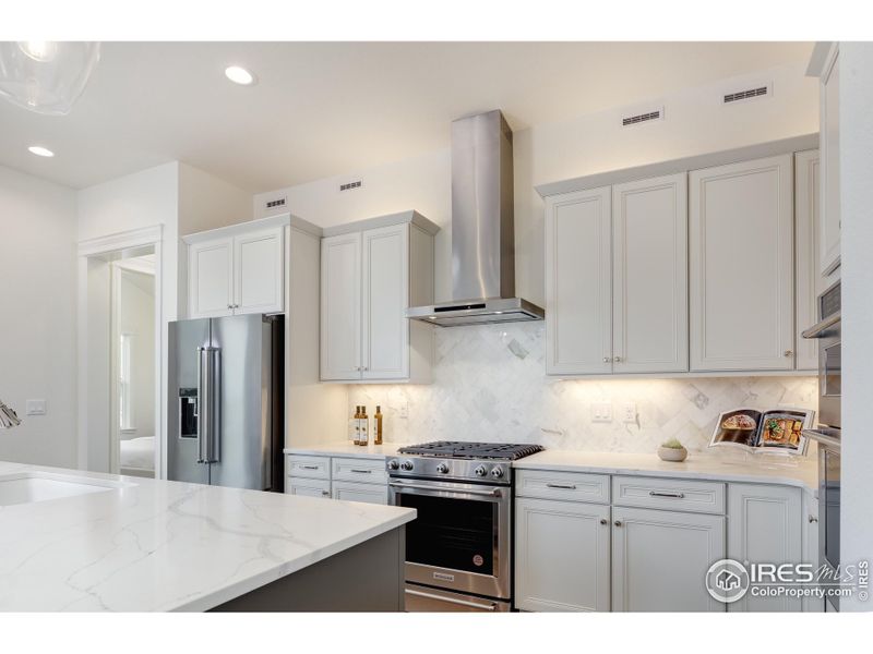 Stunning Chef's Kitchen with KitchenAid Double Ovens and Vented Range Stunning Chef's Kitchen with KitchenAid Double Ovens and Vented Range