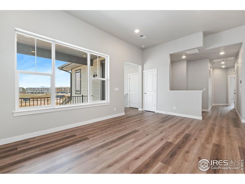 Upgraded Luxury Vinyl plank wood extended throughout the home.