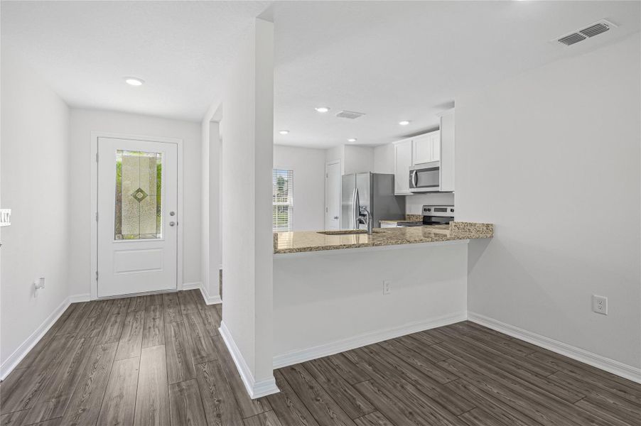 Furnished interior view inside a new home in Vero Lake Estates, Vero Beach (Image 8).