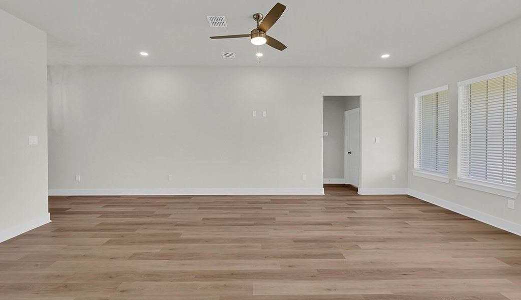 Empty room with light wood-style flooring, recessed lighting, and ceiling fan