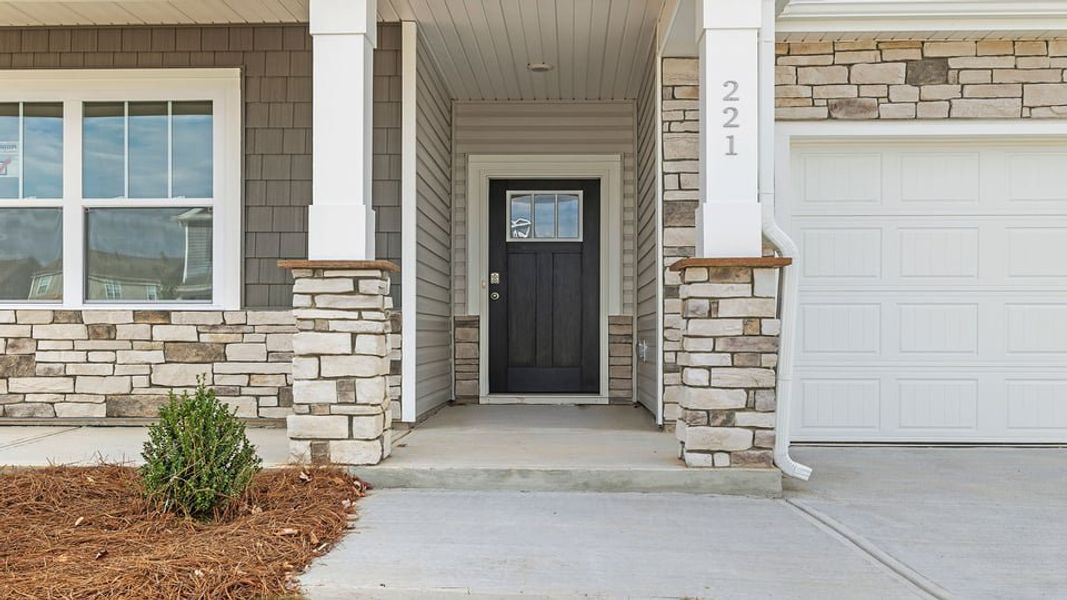 Exterior details and patio area of a home in Durbin Meadows Traditions, Fountain Inn (Image 3).