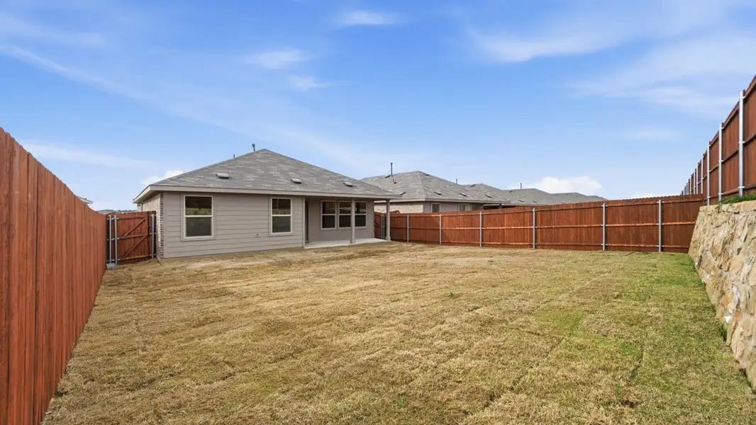 Exterior details and patio area of a home in Hickory Grove, Krum (Image 3).
