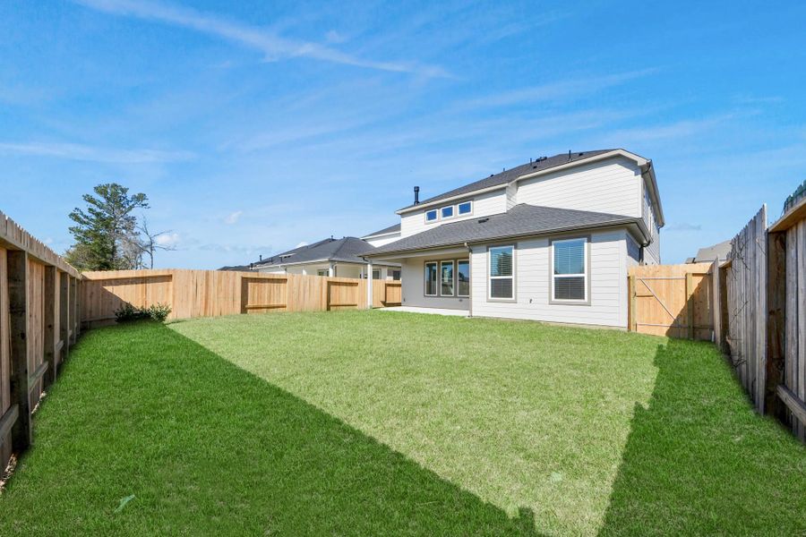 Backyard retreat, offering an abundance of space for kids to play and explore. The possibilities are endless in this outdoor haven, where the joy of open-air activities and family gatherings awaits.