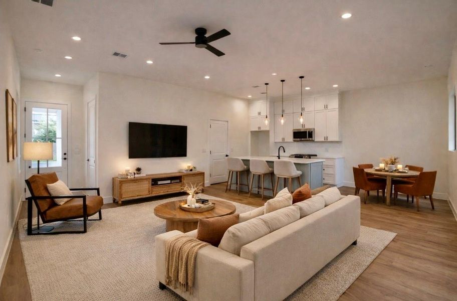 Modern open-concept kitchen seamlessly connects to the living and spacious breakfast areas. (Virtually staged) Modern open-concept kitchen seamlessly connects to the living and spacious breakfast areas. (Virtually staged)