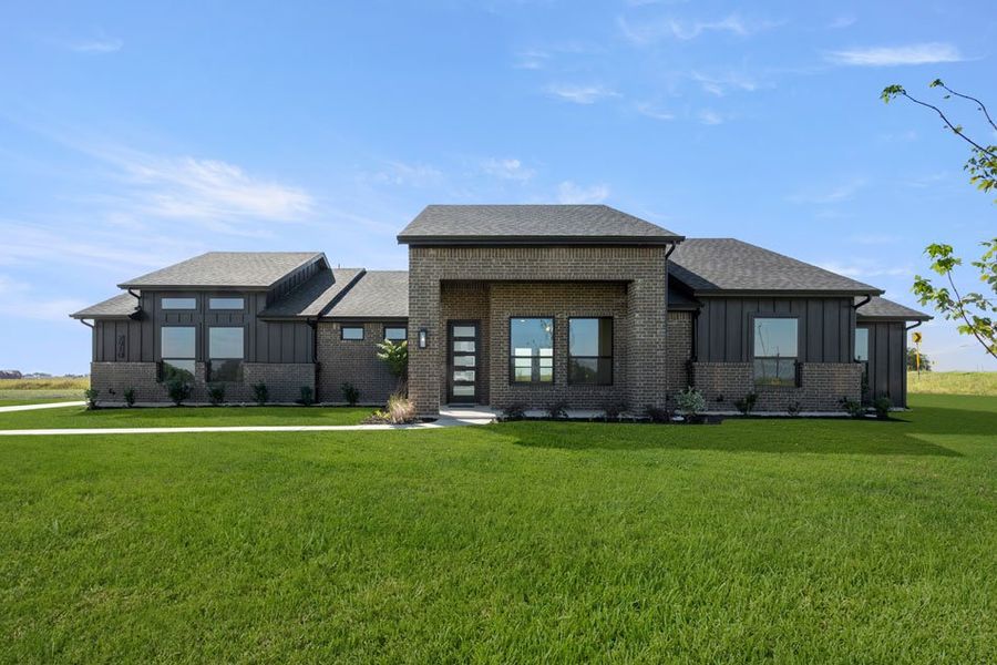 Front exterior of a new home in Carrera Ranch, Waxahachie, TX, highlighting curb appeal (Image 1).