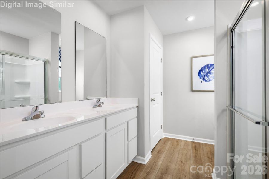 Primary Bathroom Designed With You in Mind - Spa-Inspired Shower and Dual Vanities - Every Detail Caters to Your Daily Routine and Quiet Moments of Indulgency.