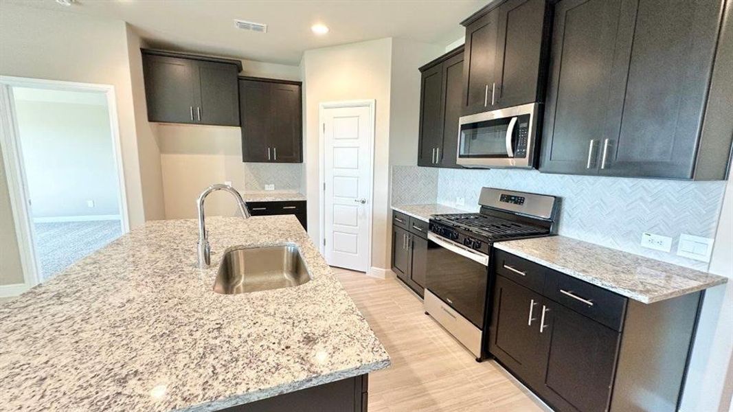 Kitchen - All Home and community information, including pricing, included features, terms, availability and amenities, are subject to change at any time without notice or obligation. All Drawings, pictures, photographs, video, square footages, floor plans, elevations, features, colors and sizes are approximate for illustration purposes only and will vary from the homes as built. Kitchen - All Home and community information, including pricing, included features, terms, availability and amenities, are subject to change at any time without notice or obligation. All Drawings, pictures, photographs, video, square footages, floor plans, elevations, features, colors and sizes are approximate for illustration purposes only and will vary from the homes as built.