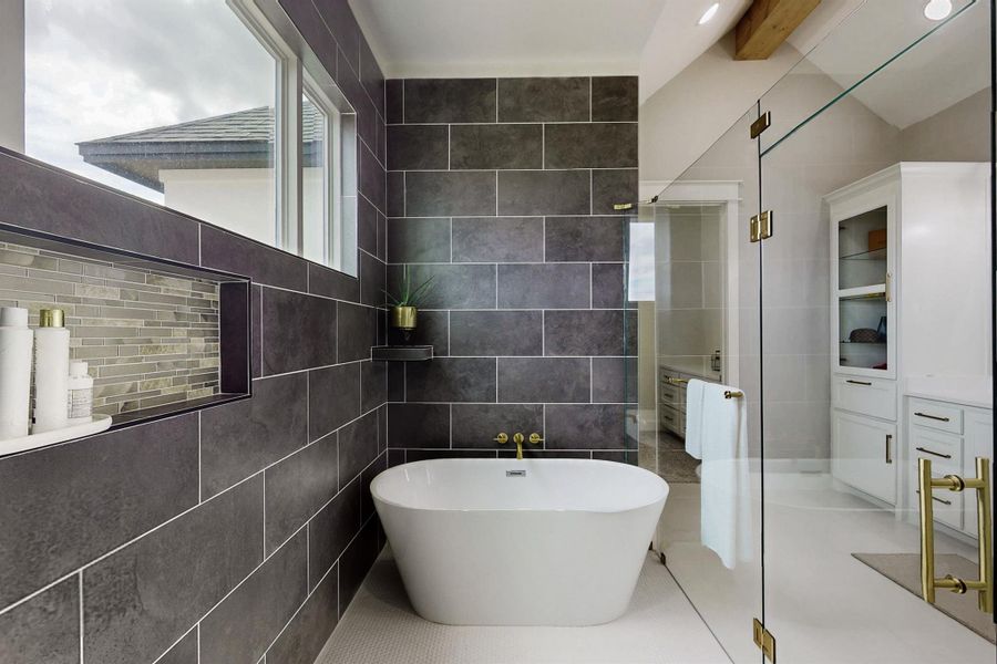 Have you ever seen a bath area like this?   Ingenious!  Helps you stay warm getting in and out.  The shower is on the other end.  Let the kids play and splash all they want!  You'll wonder why it isn't done like this more often. A one of a kind unique space that will really grow on you. The house has a total of 3.5 baths.  Notice all the natural light?  Love it!Close