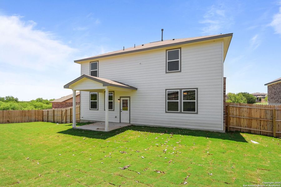 Front exterior of a new home in Comanche Ridge, San Antonio, TX, highlighting curb appeal (Image 50). Front exterior of a new home in Comanche Ridge, San Antonio, TX, highlighting curb appeal (Image 50).