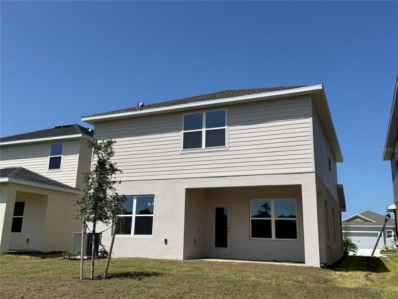 Front exterior of a new home in Harmony Central, Harmony, FL, highlighting curb appeal (Image 2). Front exterior of a new home in Harmony Central, Harmony, FL, highlighting curb appeal (Image 2).
