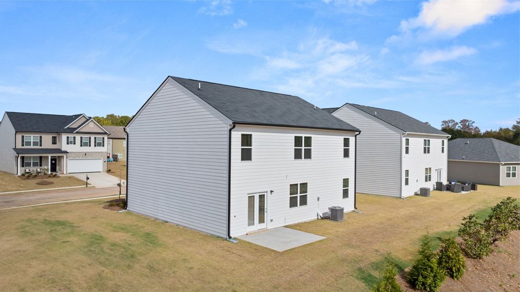 Front exterior of a new home in Locust Grove Station - Cedar Ridge, Locust Grove, GA, highlighting curb appeal (Image 18).