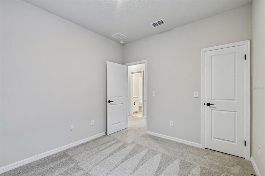 Spacious, unfurnished interior of a new home in Laureate Park at Lake Nona - Garden Series, Orlando (Image 25).