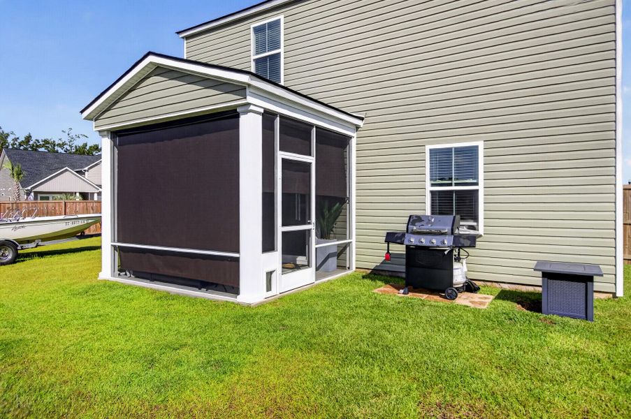 Exterior details and patio area of a home in Lindera Preserve at Cane Bay Plantation, Summerville (Image 22).