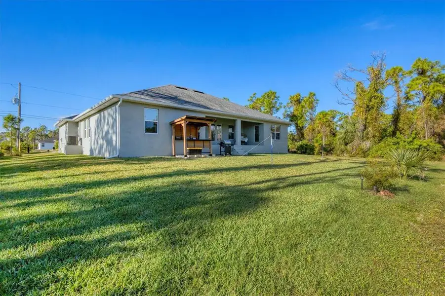 Exterior details and patio area of a home in , Port Charlotte (Image 3). Exterior details and patio area of a home in , Port Charlotte (Image 3).