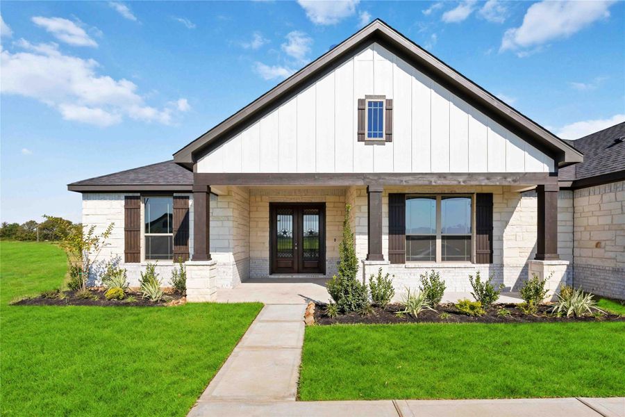 Front exterior of a new home in Blue Heron Estates, Beasley, TX, highlighting curb appeal (Image 18).