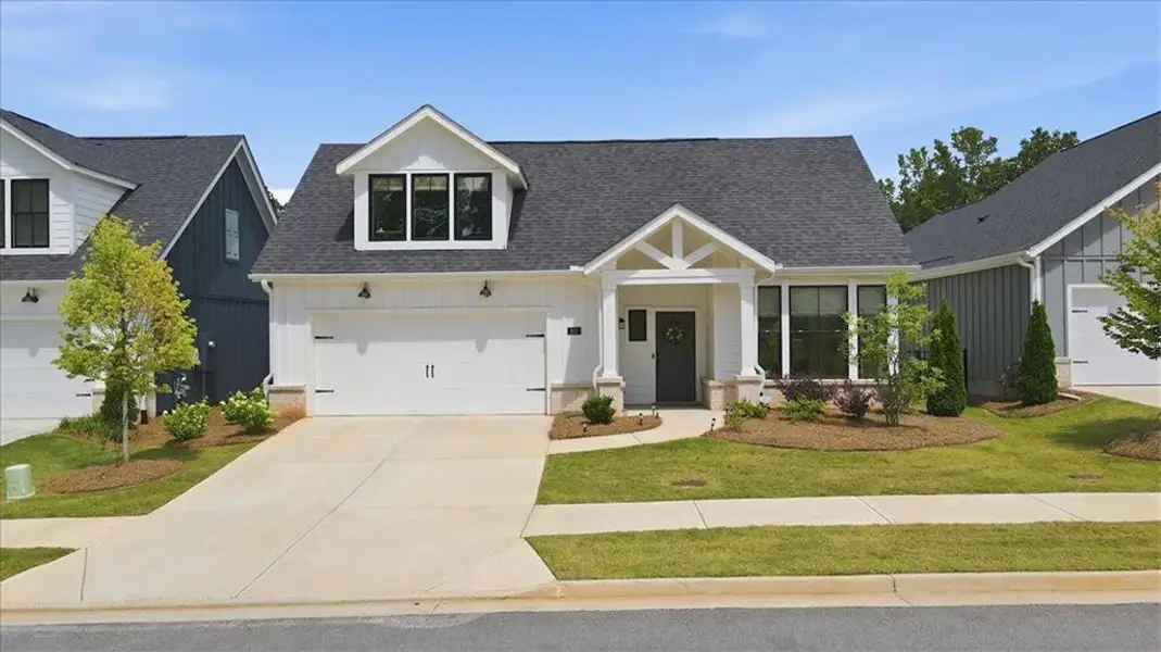 Front exterior of a new home in , Canton, GA, highlighting curb appeal (Image 1). Front exterior of a new home in , Canton, GA, highlighting curb appeal (Image 1).