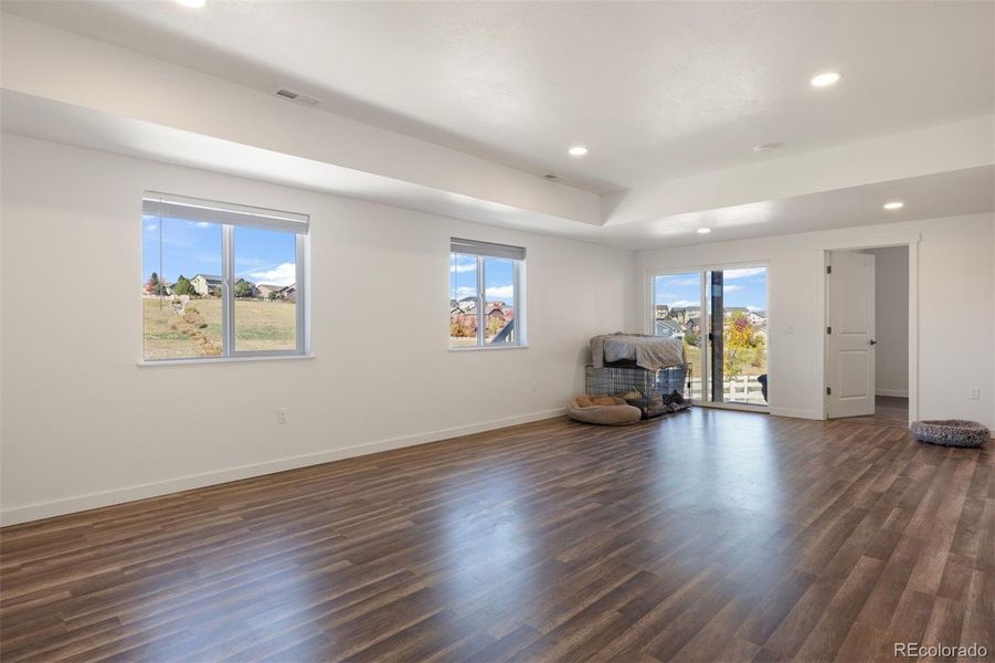 Filled with natural light from large windows and a sliding door to the patio.