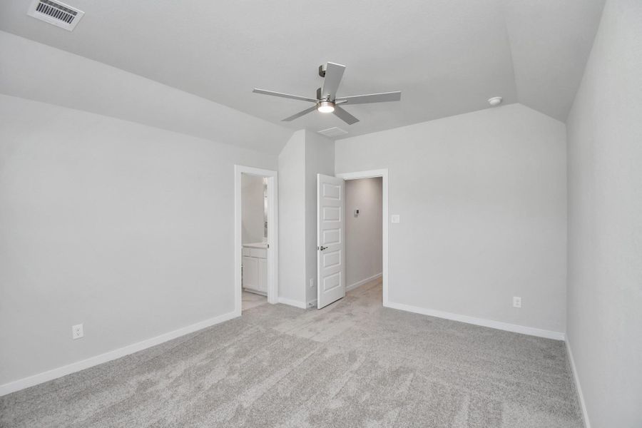 Generously sized secondary bedrooms featuring spacious closets, soft and inviting carpeting underfoot, large windows allowing plenty of natural light, and the added touch of privacy blinds for your personal retreat.Sample photo of completed home with similar floor plan. Actual colors and selections may vary.