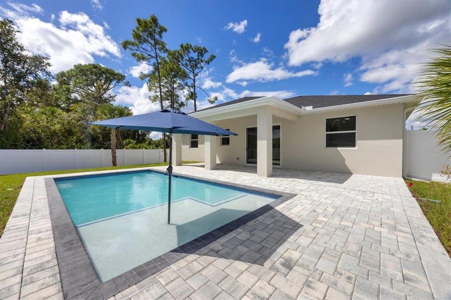 Exterior details and patio area of a home in , North Port (Image 29).