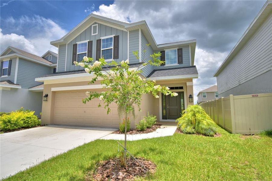 Front exterior of a new home in Villamar, Winter Haven, FL, highlighting curb appeal (Image 2). Front exterior of a new home in Villamar, Winter Haven, FL, highlighting curb appeal (Image 2).