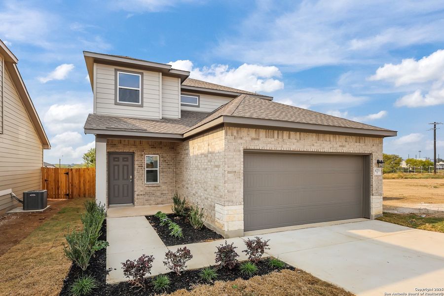 Front exterior of a new home in Garden Grove, Schertz, TX, highlighting curb appeal (Image 20).