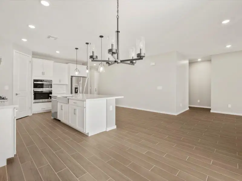 Spacious, unfurnished interior of a new home in Blossom Rock Reserve Series, Apache Junction (Image 10).