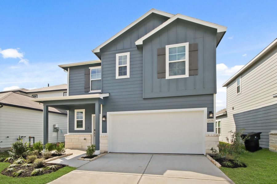 Front exterior of a new home in Barrett Crossing, Crosby, TX, highlighting curb appeal (Image 2). Front exterior of a new home in Barrett Crossing, Crosby, TX, highlighting curb appeal (Image 2).