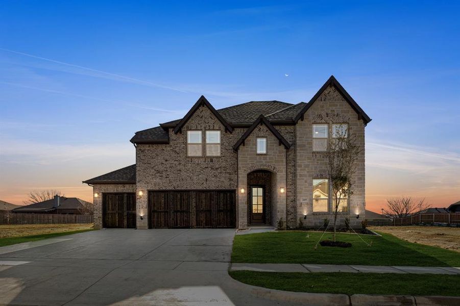 Front exterior of a new home in Parks at Panchasarp Farms, Burleson, TX, highlighting curb appeal (Image 2). Front exterior of a new home in Parks at Panchasarp Farms, Burleson, TX, highlighting curb appeal (Image 2).