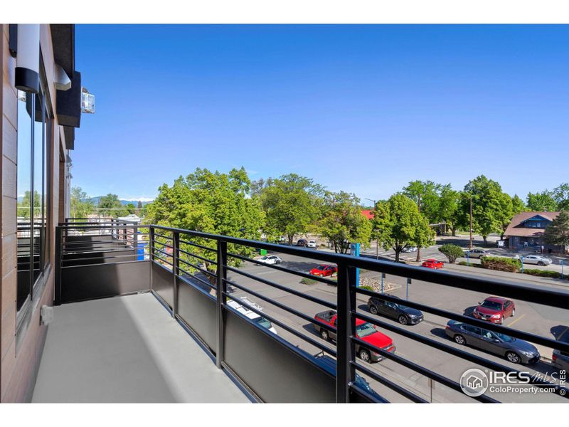 Patio looks over a private, well-maintained parking lot. No staring right into your neighbor's windows!