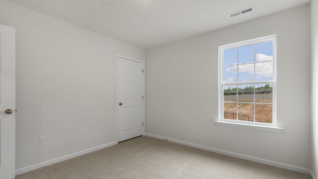 Spacious, unfurnished interior of a new home in The Grove at Matthews Landing, Fuquay Varina (Image 22).