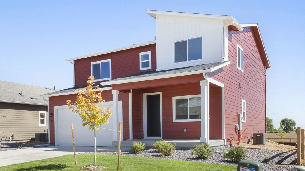 Front exterior of a new home in Granary, Johnstown, CO, highlighting curb appeal (Image 22). Front exterior of a new home in Granary, Johnstown, CO, highlighting curb appeal (Image 22).