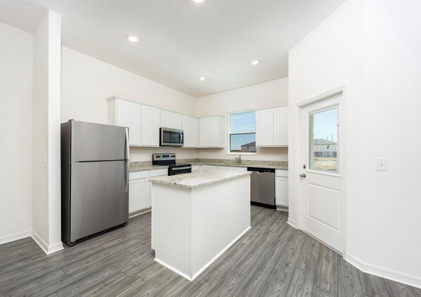 A chef-ready kitchen filled with stainless steel appliances and granite countertops