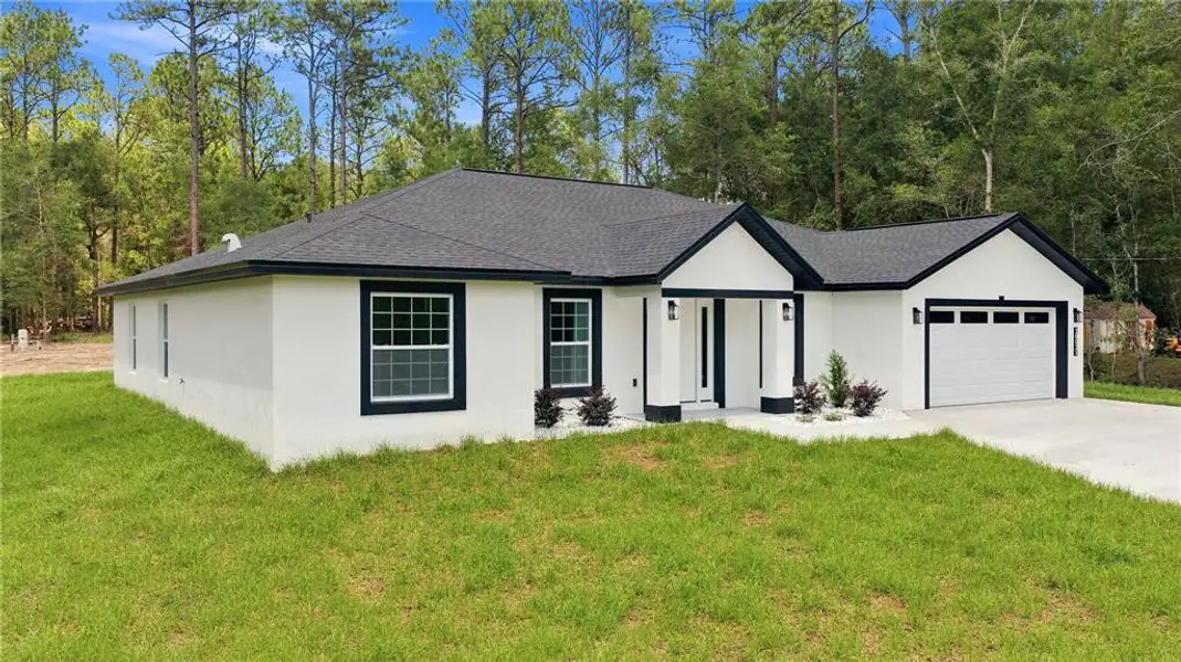 Front exterior of a new home in , Dunnellon, FL, highlighting curb appeal (Image 2). Front exterior of a new home in , Dunnellon, FL, highlighting curb appeal (Image 2).