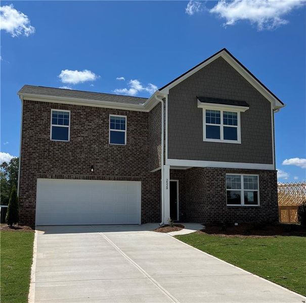 Front exterior of a new home in Silverton, Dacula, GA, highlighting curb appeal (Image 1).
