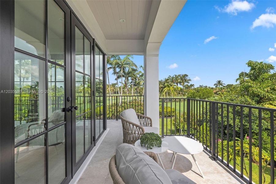 Primary bedroom balcony overlooks gold course Primary bedroom balcony overlooks gold course