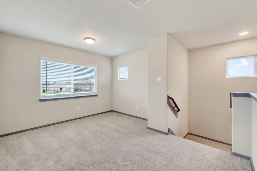 Spacious, unfurnished interior of a new home in Sunterra, Katy (Image 34).