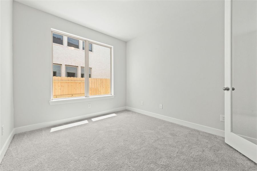 Spacious, unfurnished interior of a new home in Sunterra, Katy (Image 17).