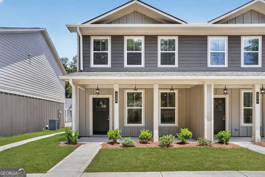 Front exterior of a new home in The Cottages at East Lanier, Fayetteville, GA, highlighting curb appeal (Image 2). Front exterior of a new home in The Cottages at East Lanier, Fayetteville, GA, highlighting curb appeal (Image 2).