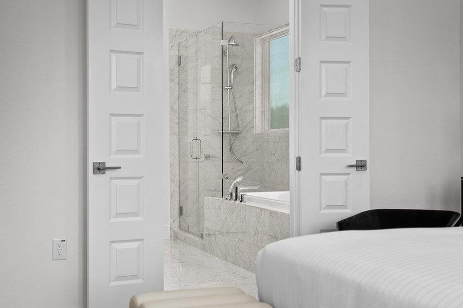 Spa-inspired primary ensuite featuring elegant Carrara marble finishes.