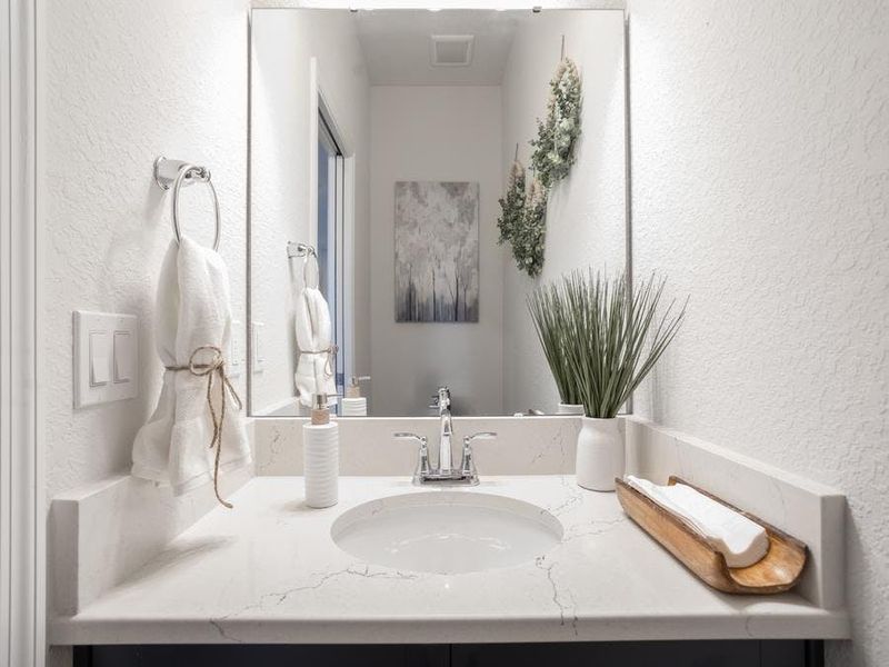 And, a convenient powder room serves guests - Shelby II by Highland Homes