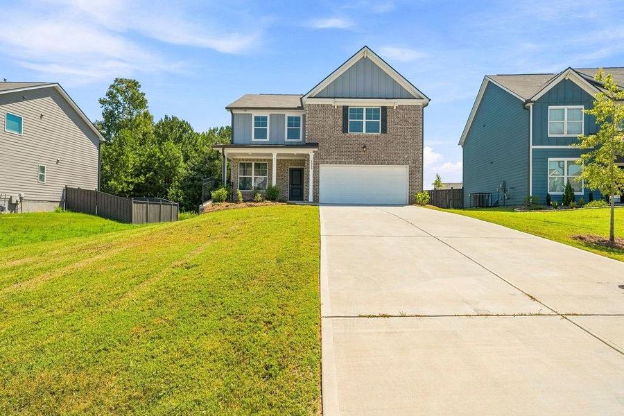 Front exterior of a new home in , Austell, GA, highlighting curb appeal (Image 1). Front exterior of a new home in , Austell, GA, highlighting curb appeal (Image 1).