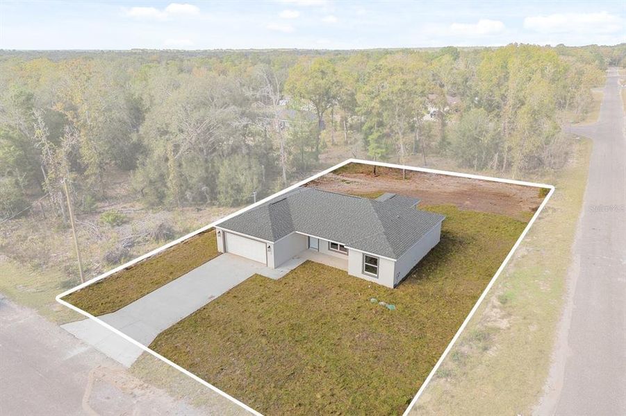 Front exterior of a new home in , Ocklawaha, FL, highlighting curb appeal (Image 22).