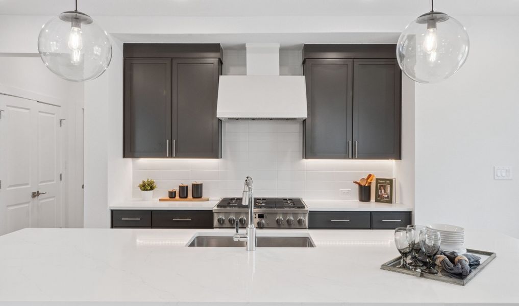 Kitchen with full-height tile backsplash Kitchen with full-height tile backsplash