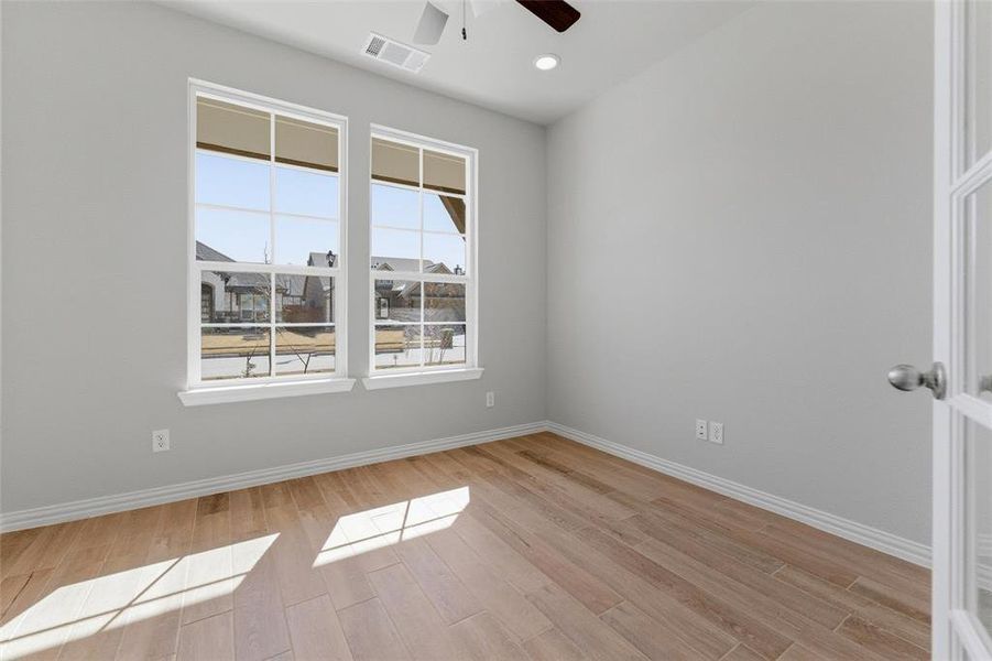 Unfurnished room with light wood-style floors, ceiling fan, and recessed lighting