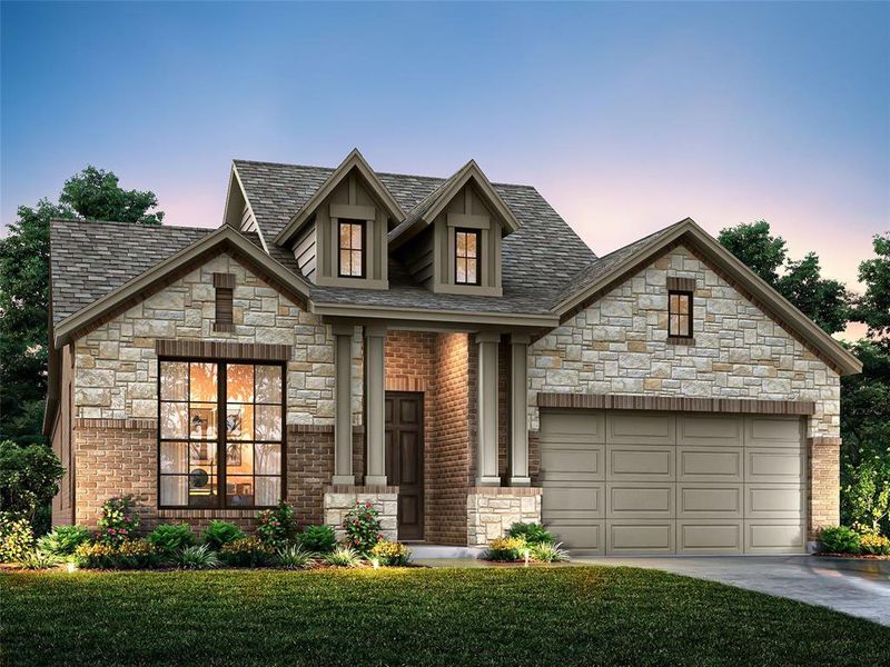 View of front of home with a lawn and a garage